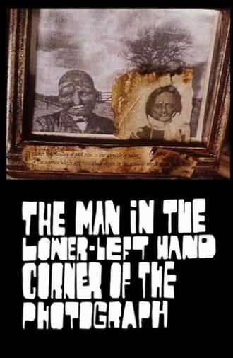 The Man in the Lower-Left Hand Corner of The Photograph (1997)